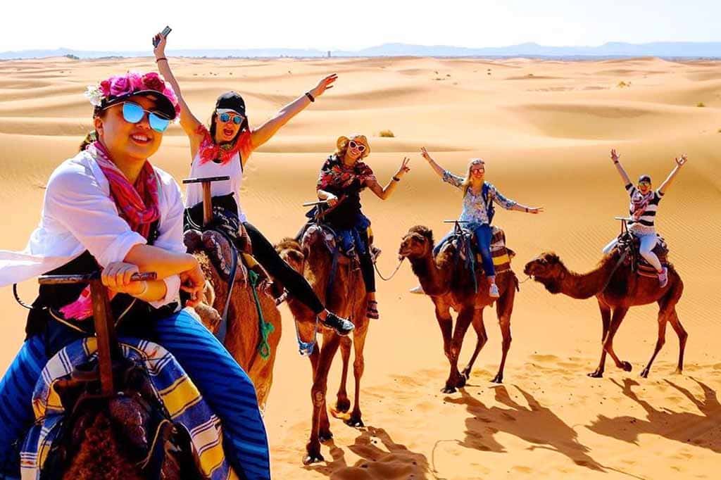 Camel excursion at sunset in Merzouga - Moroccan Sahara